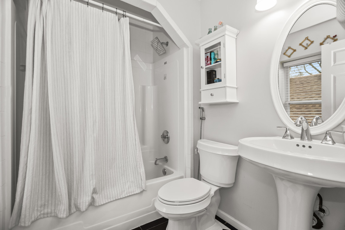1811 Lyons Street Evanston, IL 60201 - Photo 16 of 33 a bathroom with a sink toilet and a mirror