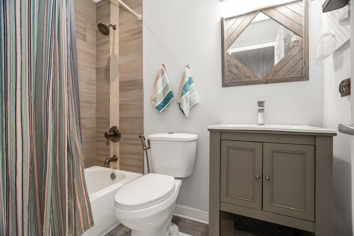 1811 Lyons Street Evanston, IL 60201 - Photo 22 of 33 a bathroom with a toilet sink and vanity