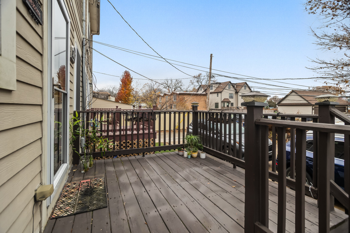 1811 Lyons Street Evanston, IL 60201 - Photo 30 of 33 a view of a balcony with wooden floor