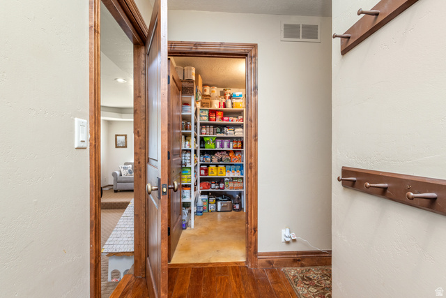 892 Cambridge Drive St. George, UT 84770 - Photo 14 of 65 Hardwood flooring with wood-trim doorway and built-in wall hooks