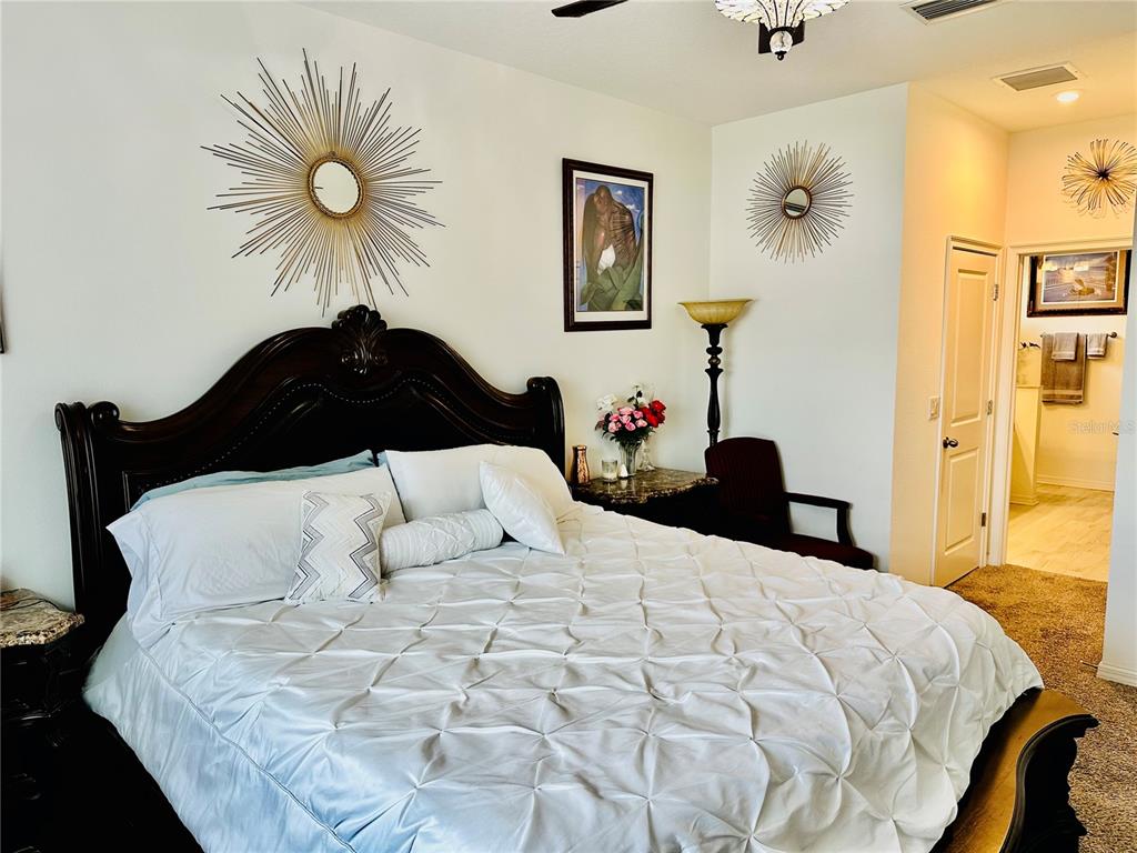 944 Old Windsor Way Spring Hill, FL 34609 - Photo 12 of 31 a large white bed in a white room