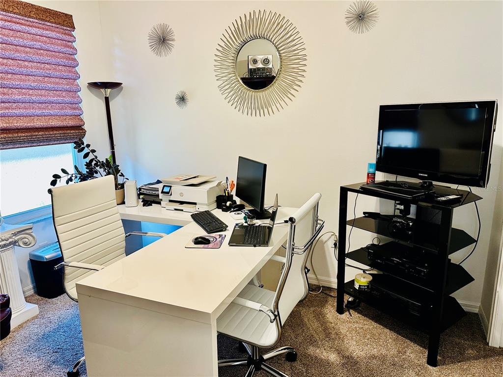 944 Old Windsor Way Spring Hill, FL 34609 - Photo 18 of 31 a view of a workspace with furniture