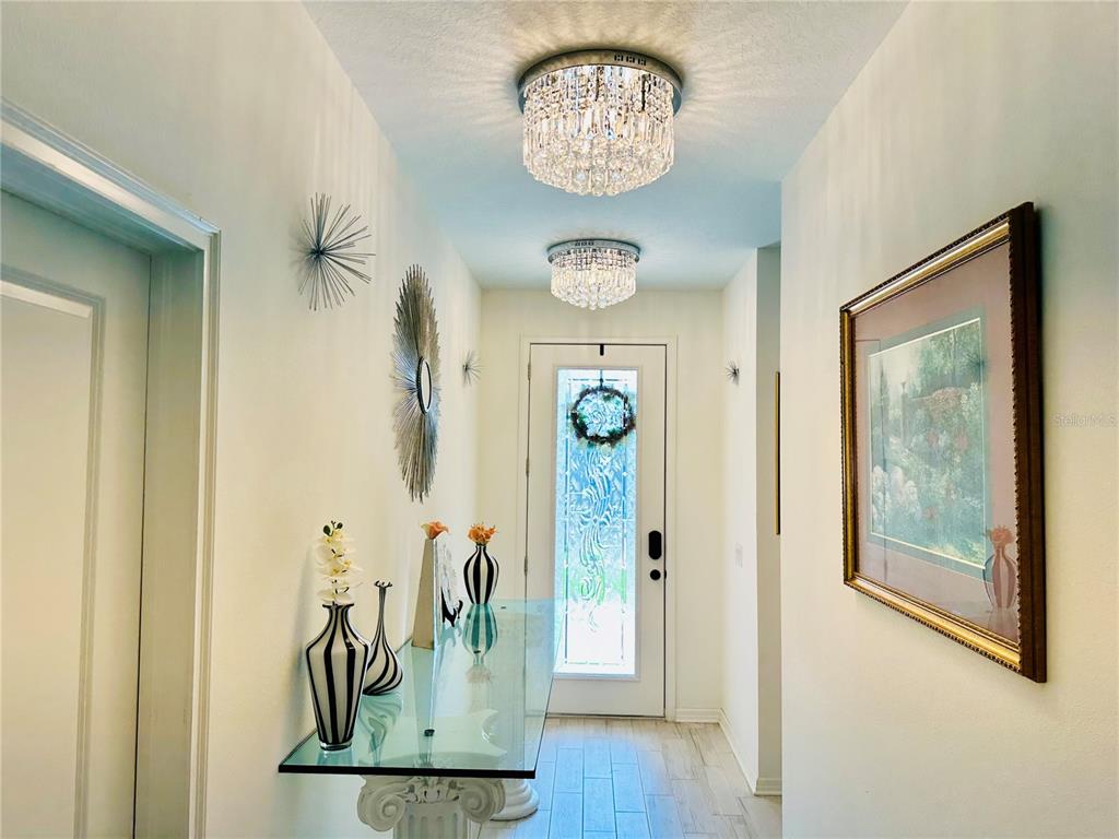 944 Old Windsor Way Spring Hill, FL 34609 - Photo 2 of 31 a view of a hallway with interior of the house