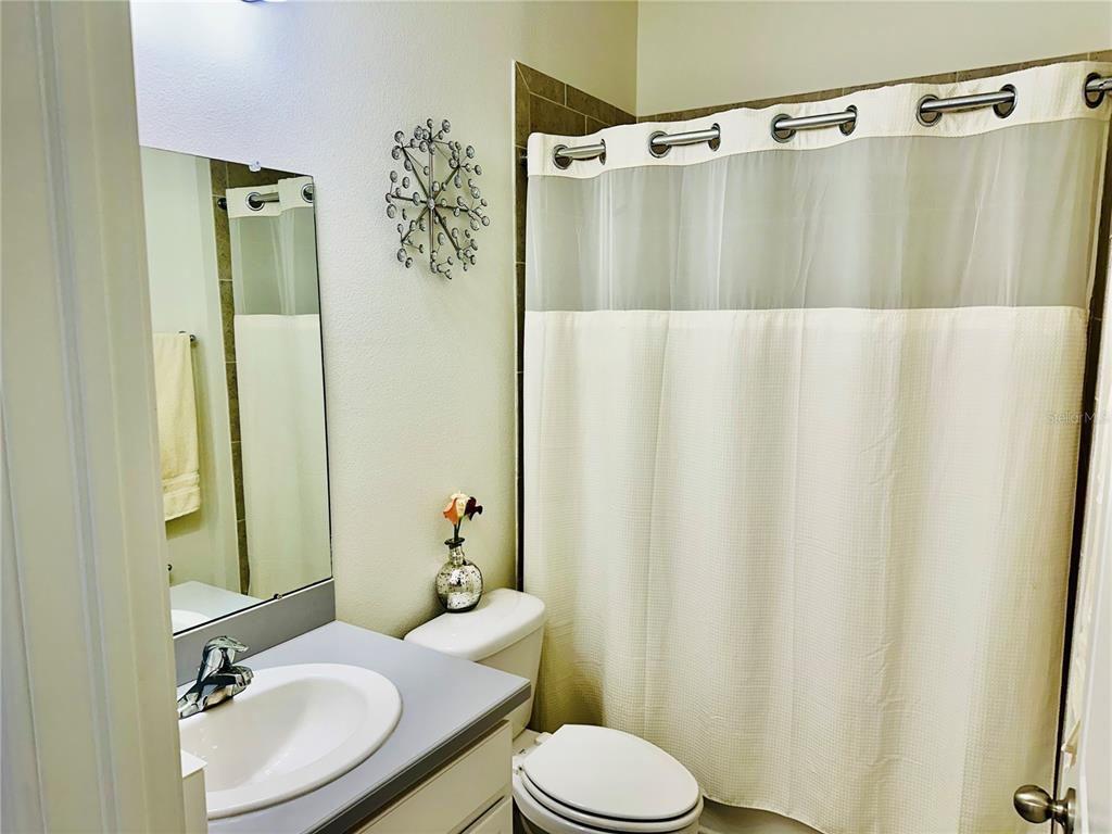 944 Old Windsor Way Spring Hill, FL 34609 - Photo 22 of 31 a bathroom with a sink and toilet