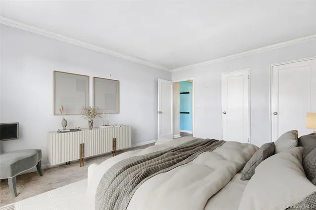 a bedroom with two beds and white walls