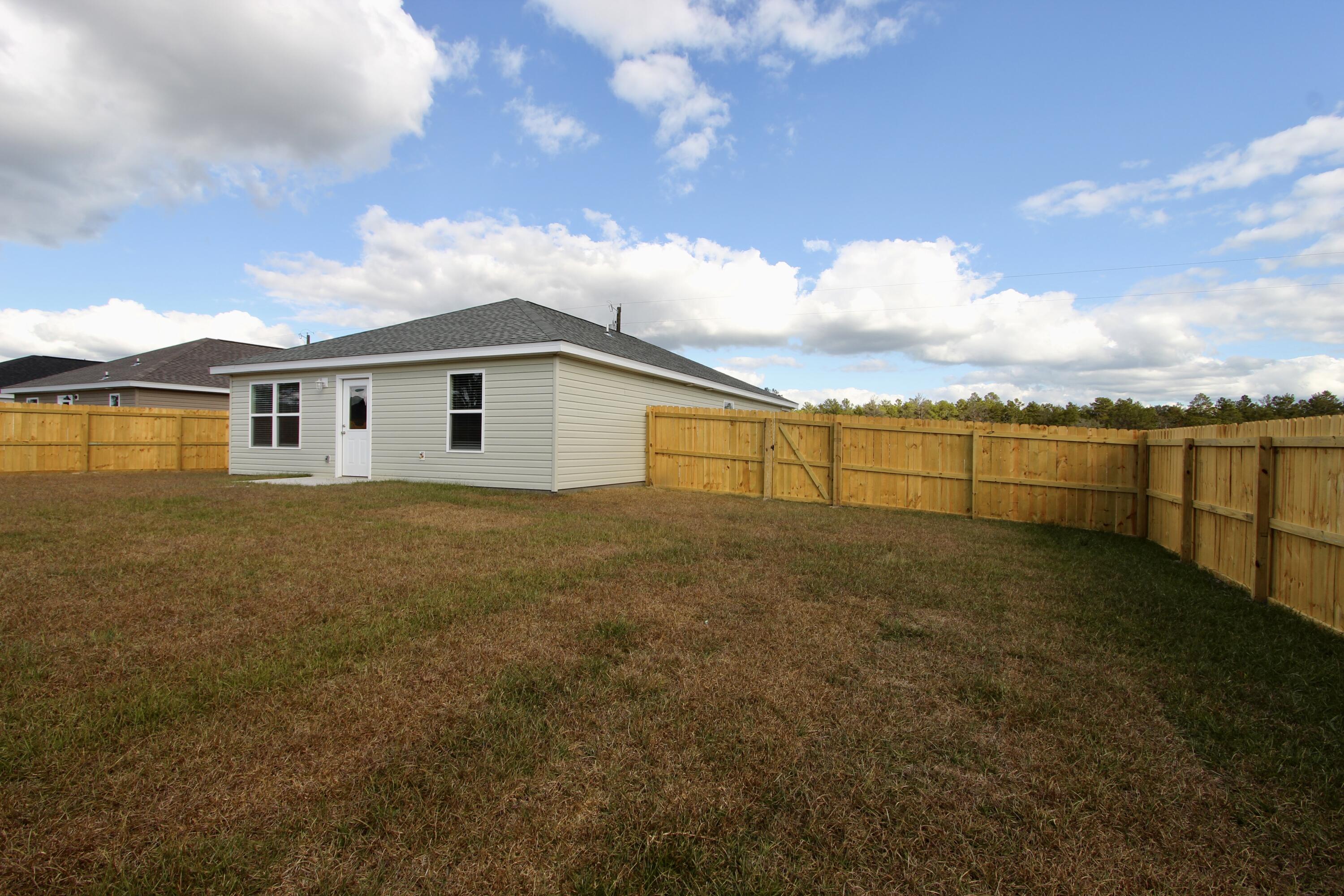 5366 Highview Drive Crestview, FL 32539 - Photo 19 of 19 a view of an ocean with a house in the background