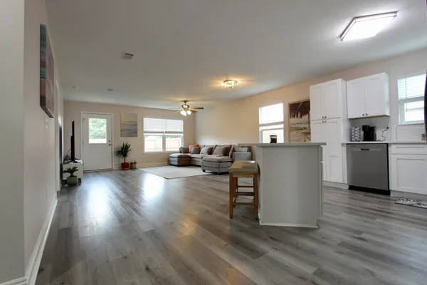 a view of kitchen and dining room with wooden floor
