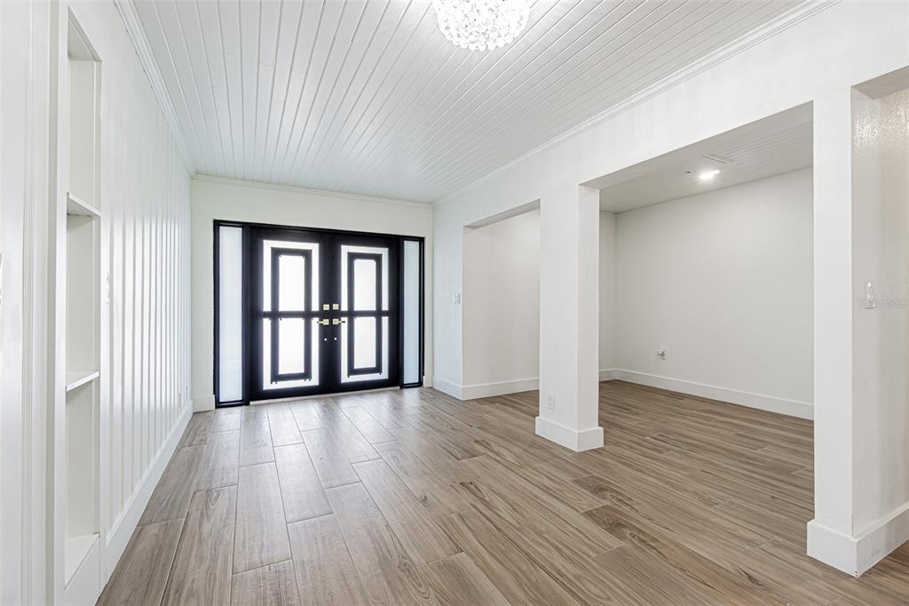 5302 Turkey Creek Road Plant City, FL 33567 - Photo 13 of 46 wooden floor in an empty room with a window