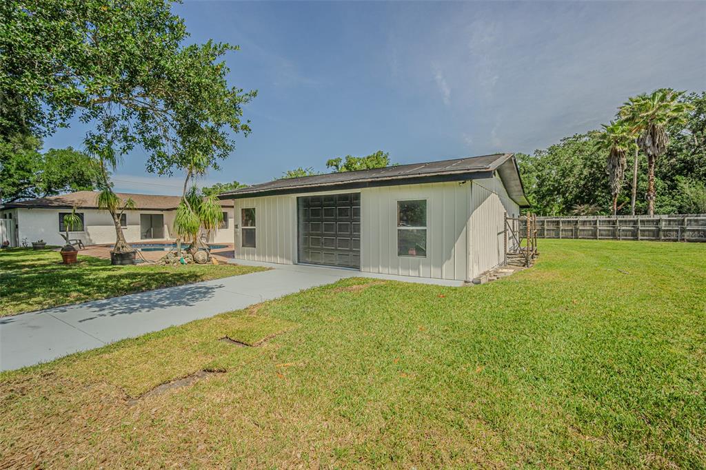 5302 Turkey Creek Road Plant City, FL 33567 - Photo 38 of 46 a front view of house with yard and green space