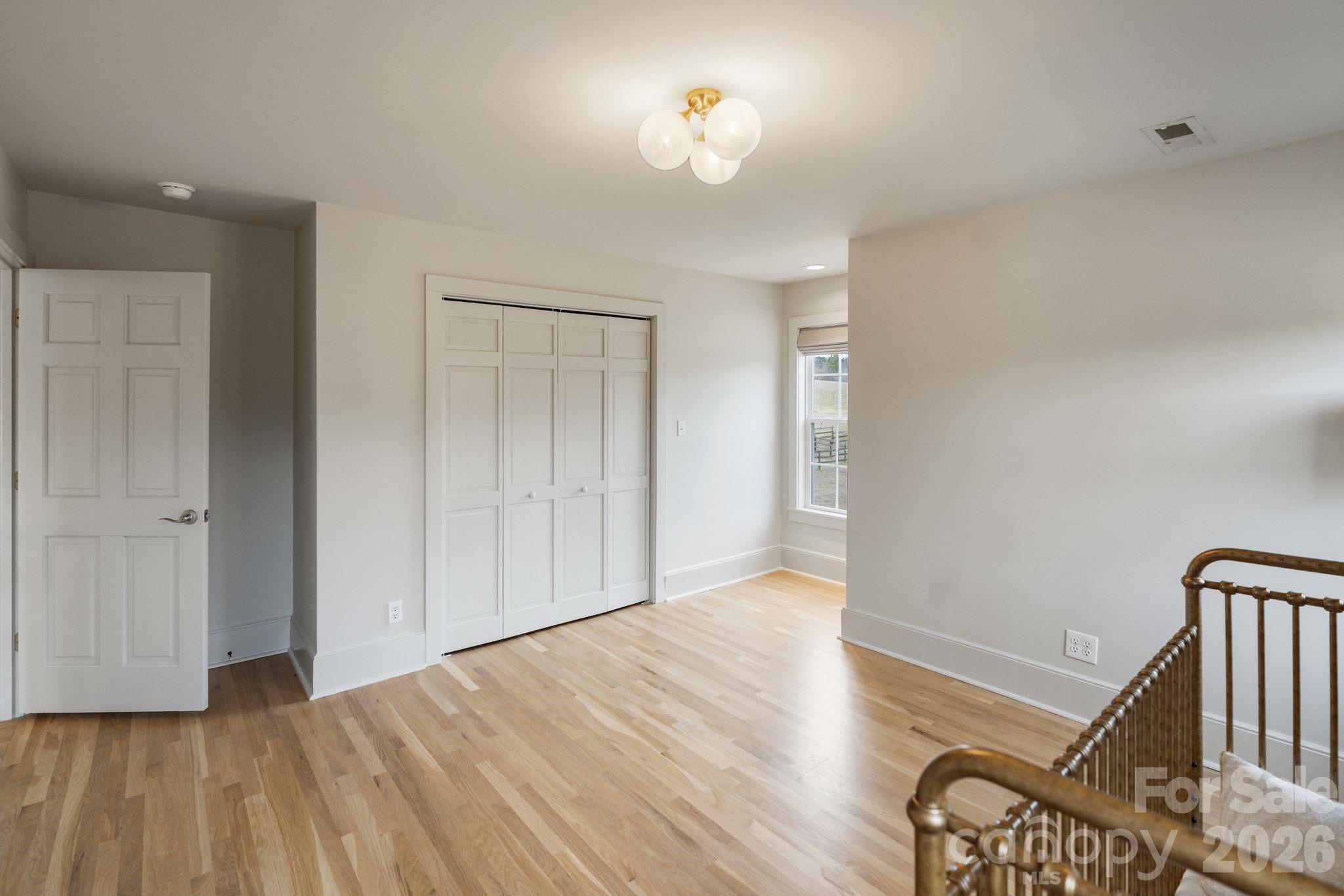 940 State Rd S-13-106 Pageland, SC 29728 - Photo 23 of 41 wooden floor in an empty room with a window