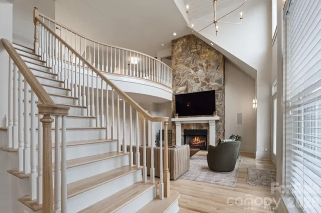a view of entryway livingroom and hall with wooden floor