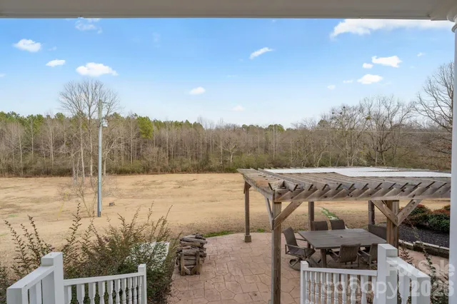 a view of a patio with a table and chairs