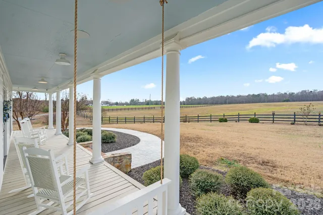 a view of swimming pool from a balcony