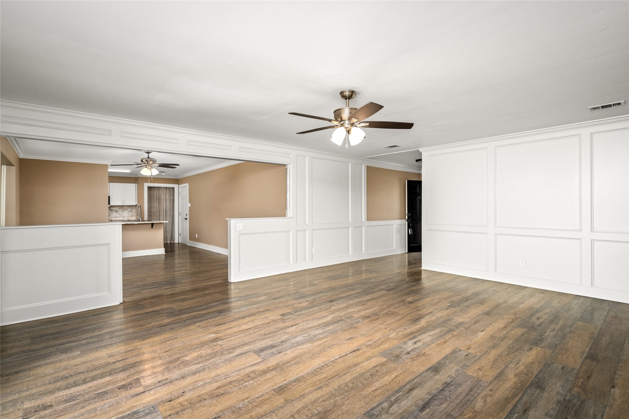 3603 Glenmeadow Drive Rosenberg, TX 77471 - Photo 17 of 27 wooden floor in an empty room with a window