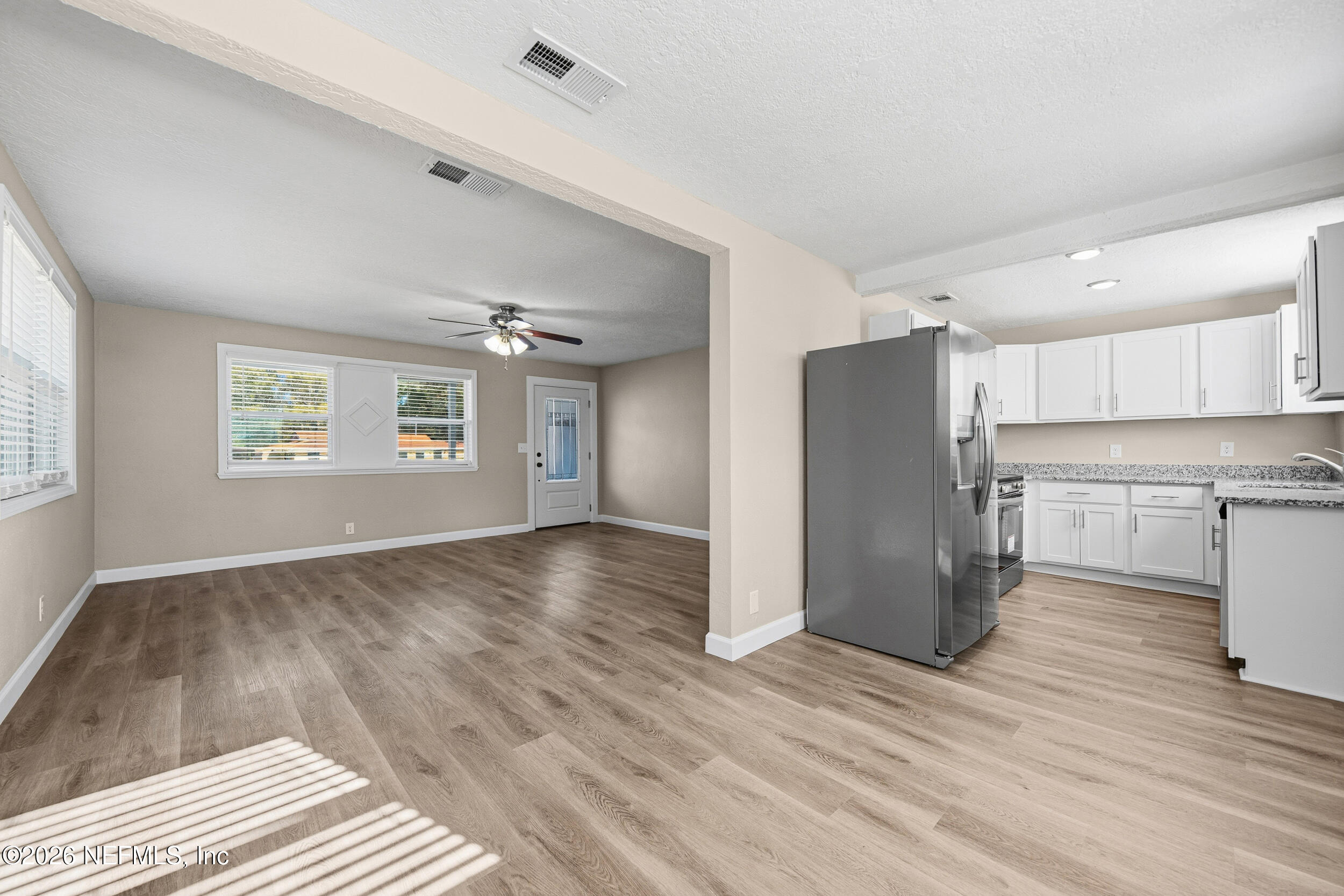 1643 Spruce Street Green Cove Springs, FL 32043 - Photo 11 of 31 a view of empty room with wooden floor and window