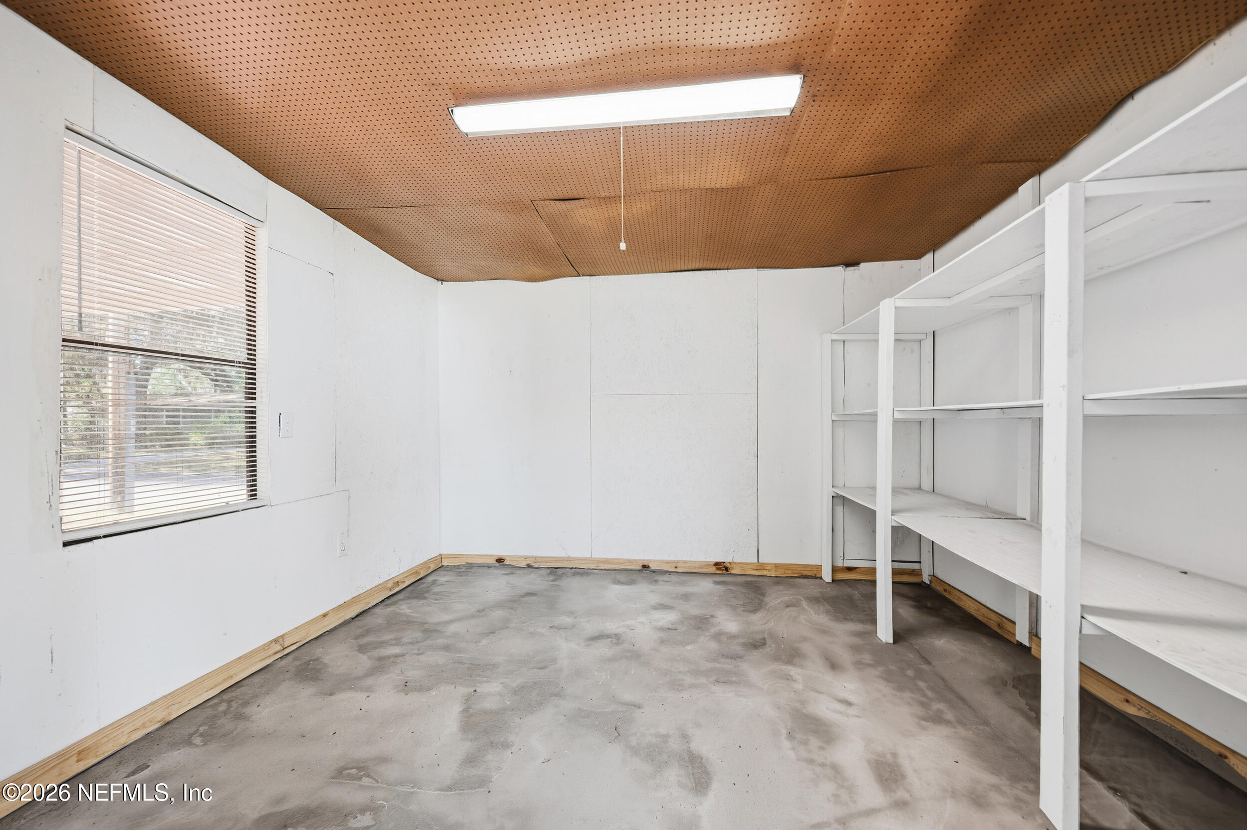 1643 Spruce Street Green Cove Springs, FL 32043 - Photo 28 of 31 a view of an empty room with a window