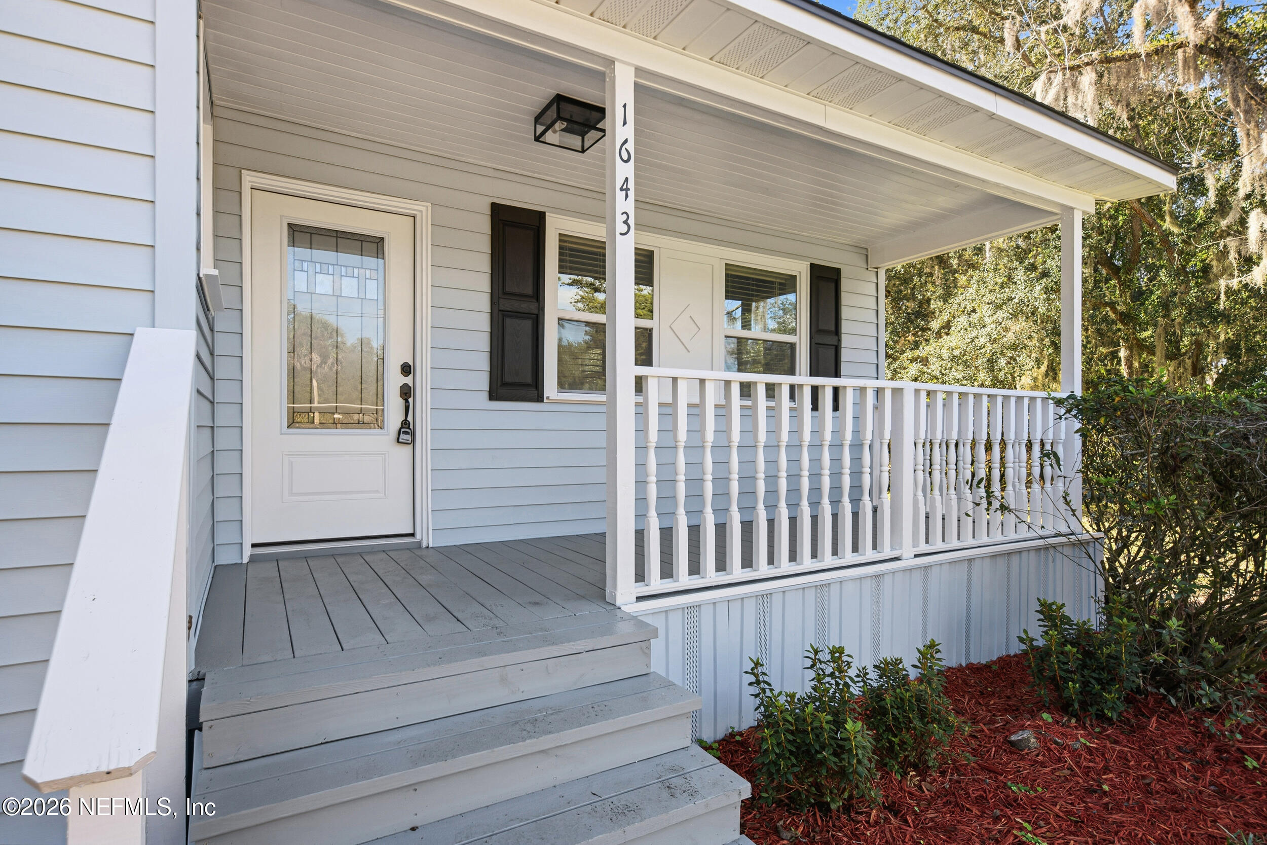 1643 Spruce Street Green Cove Springs, FL 32043 - Photo 6 of 31 a view of porch with deck and garden