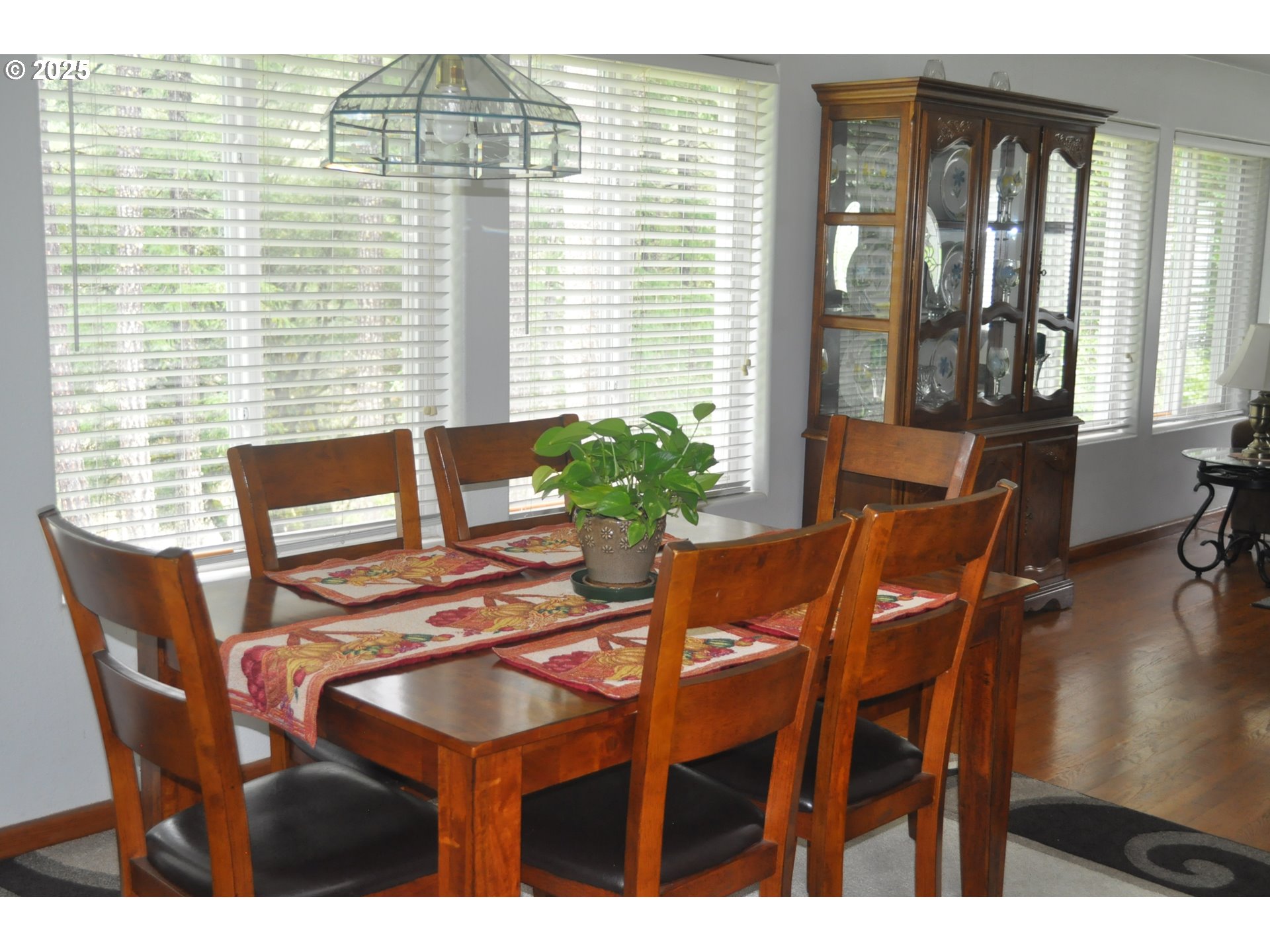 4215 Mt Reuben Road Glendale, OR 97442 - Photo 11 of 40 a view of a dining room with furniture and wooden floor