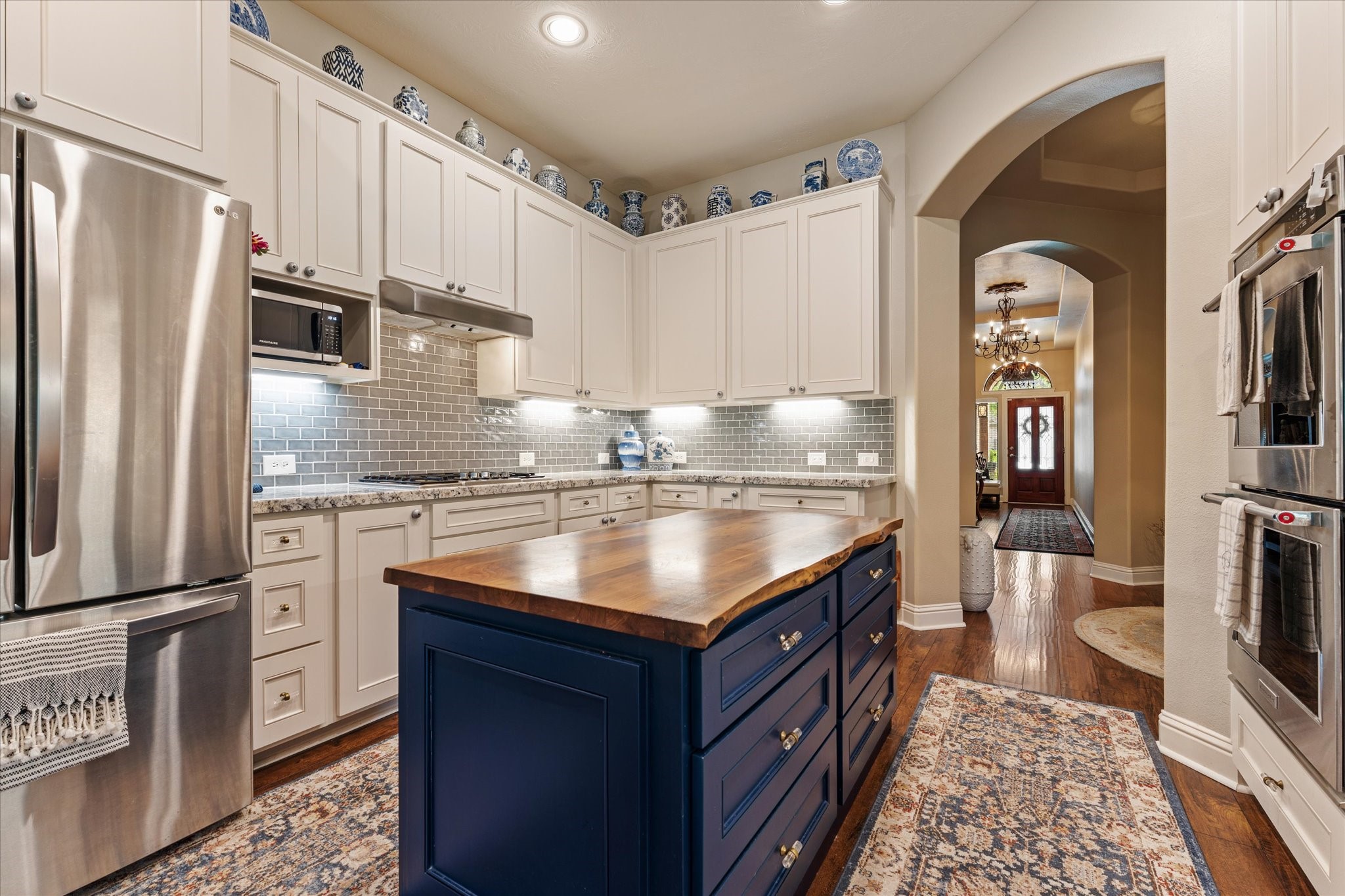 19039 Panther Peak Spring, TX 77388 - Photo 16 of 49 a kitchen with stainless steel appliances granite countertop a sink stove and refrigerator