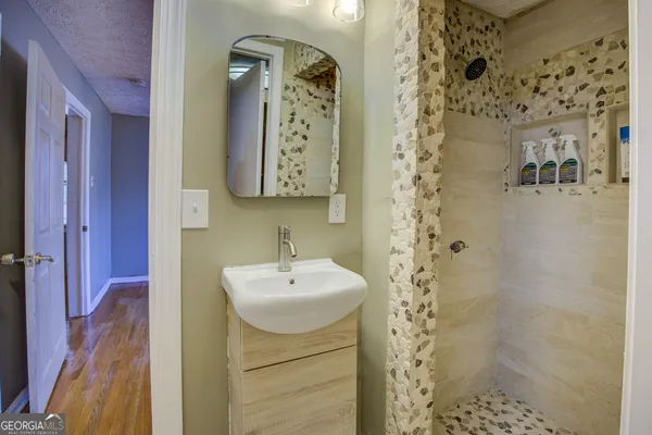 a bathroom with a sink and mirror