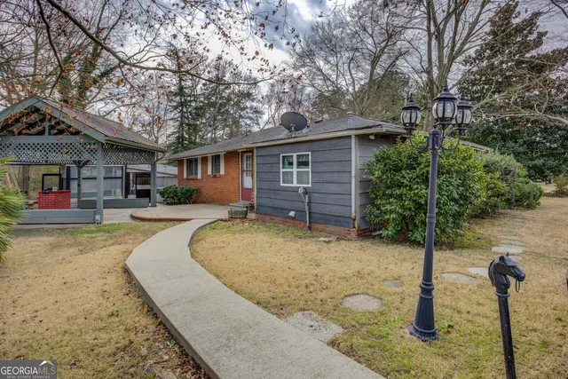 a front view of a house with garden