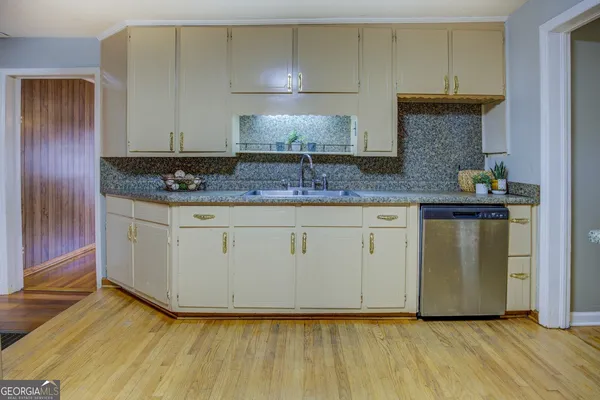 a kitchen with granite countertop wooden cabinets and a granite counter tops