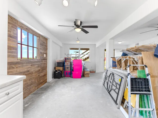 a bedroom with furniture and a chandelier