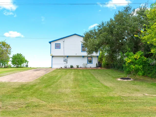 a view of a backyard with a small cabin