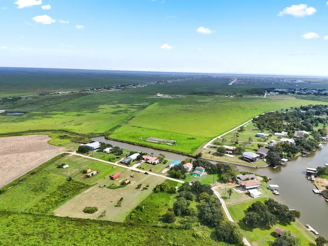 an aerial view of a golf course with ocean view