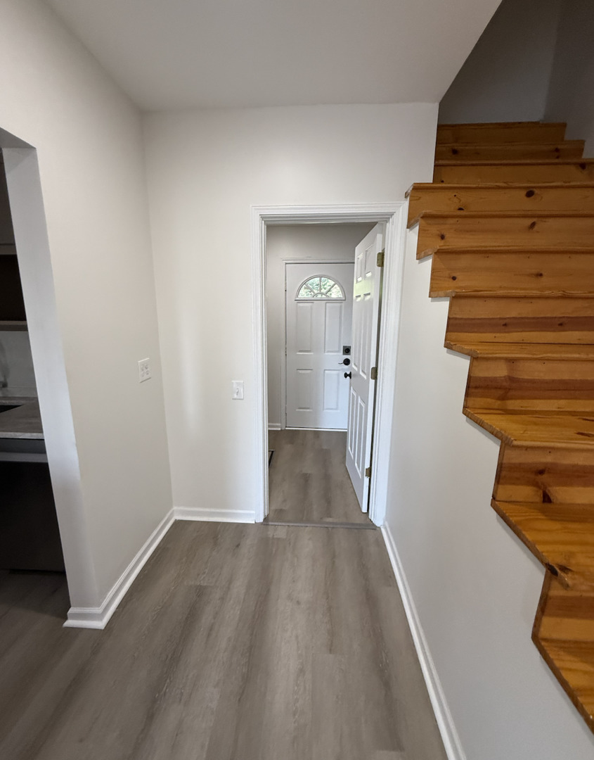59 9s115 Route, Unit 1 Naperville, IL 60564 - Photo 9 of 12 wooden floor in an empty room