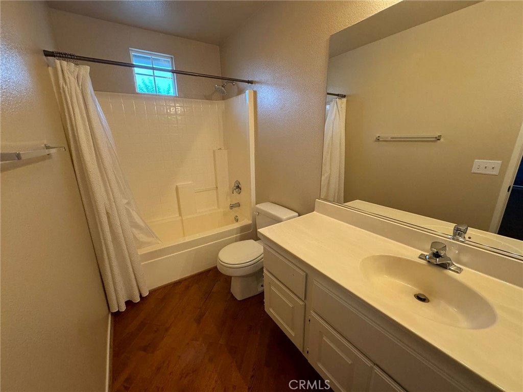 31781 Canyon Estates Drive Lake Elsinore, CA 92532 - Photo 20 of 25 a bathroom with a sink a toilet and shower