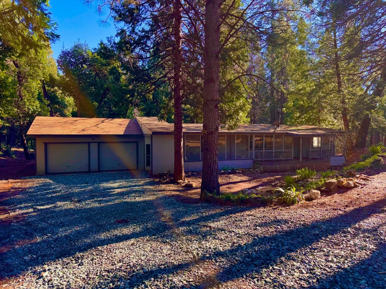 5790 Reservoir Road Georgetown, CA 95634 - Photo 1 of 7 a front view of a house with garden
