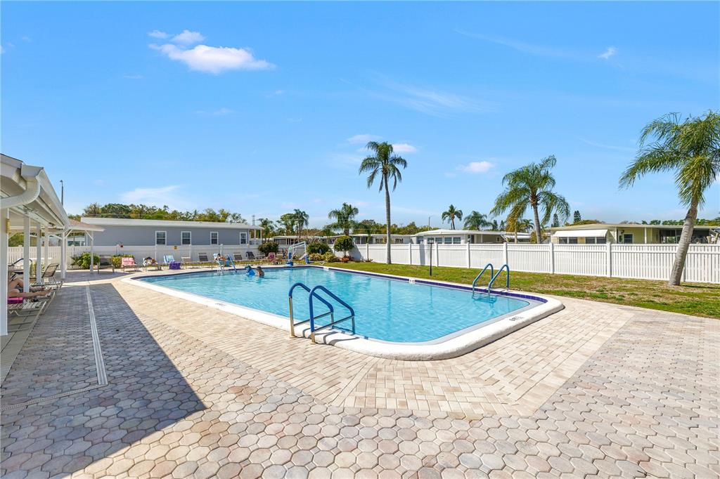 1100 South Belcher Road, Unit 502 Largo, FL 33771 - Photo 39 of 51 a view of a swimming pool with an outdoor seating