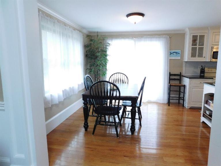62 Quisset Road Centerville, MA 02632 - Photo 10 of 25 a view of a dining room with furniture and wooden floor