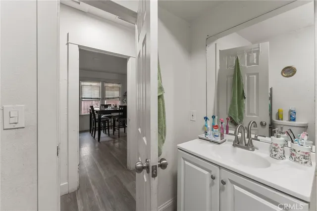 a en suite bathroom with a sink double vanity and a mirror
