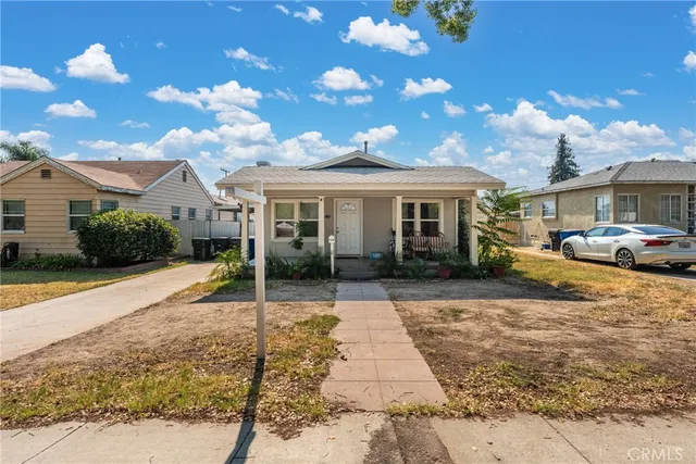 a front view of a house with yard