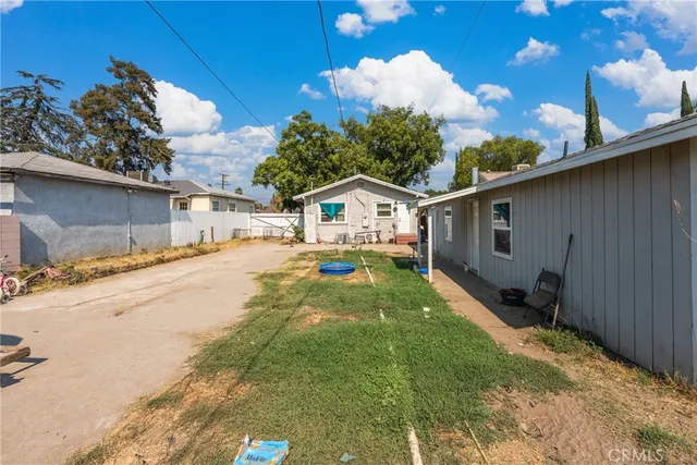 a view of a backyard of the house