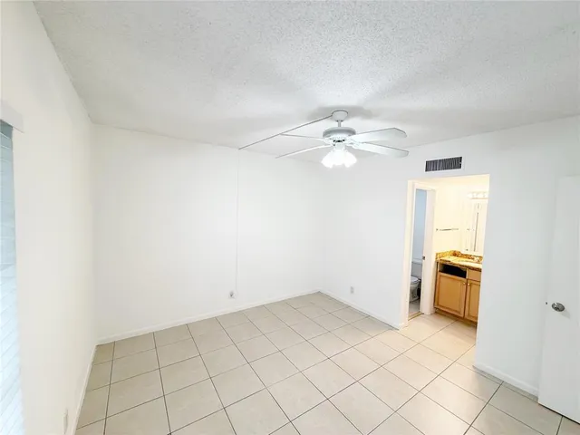 an empty room with a bathroom