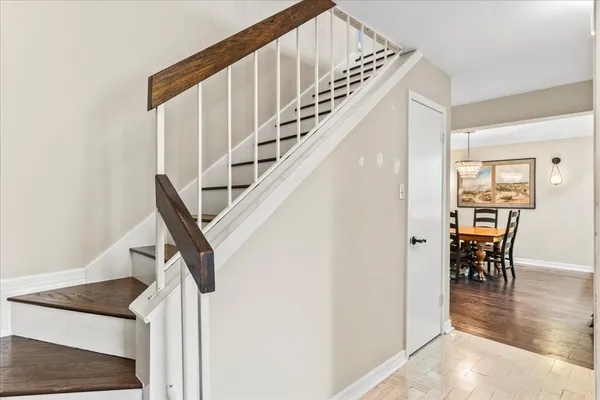 a bedroom with a bed and a dresser in it
