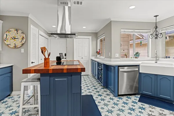 a kitchen with a sink and a refrigerator