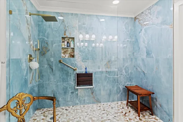 a bathroom with a toilet sink and shower