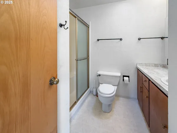 a white toilet sitting next to a bathroom sink