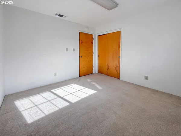 a view of an empty room and window