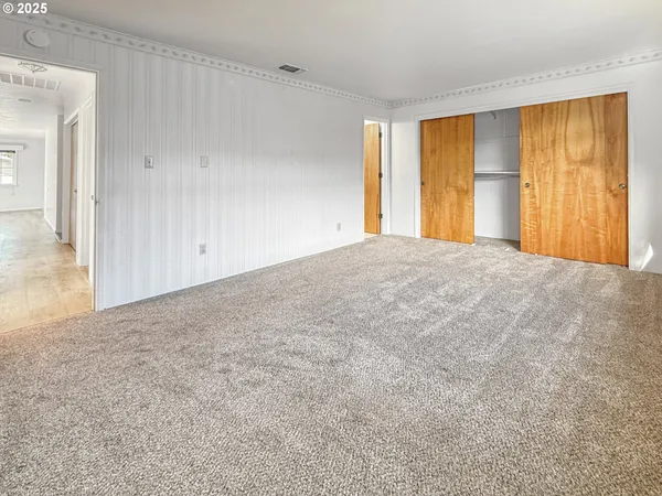 a view of an empty room with a window