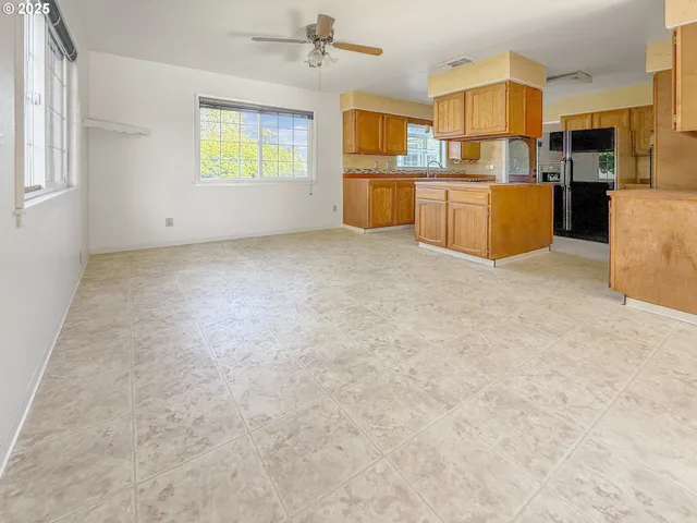 a view of a kitchen with furniture and window