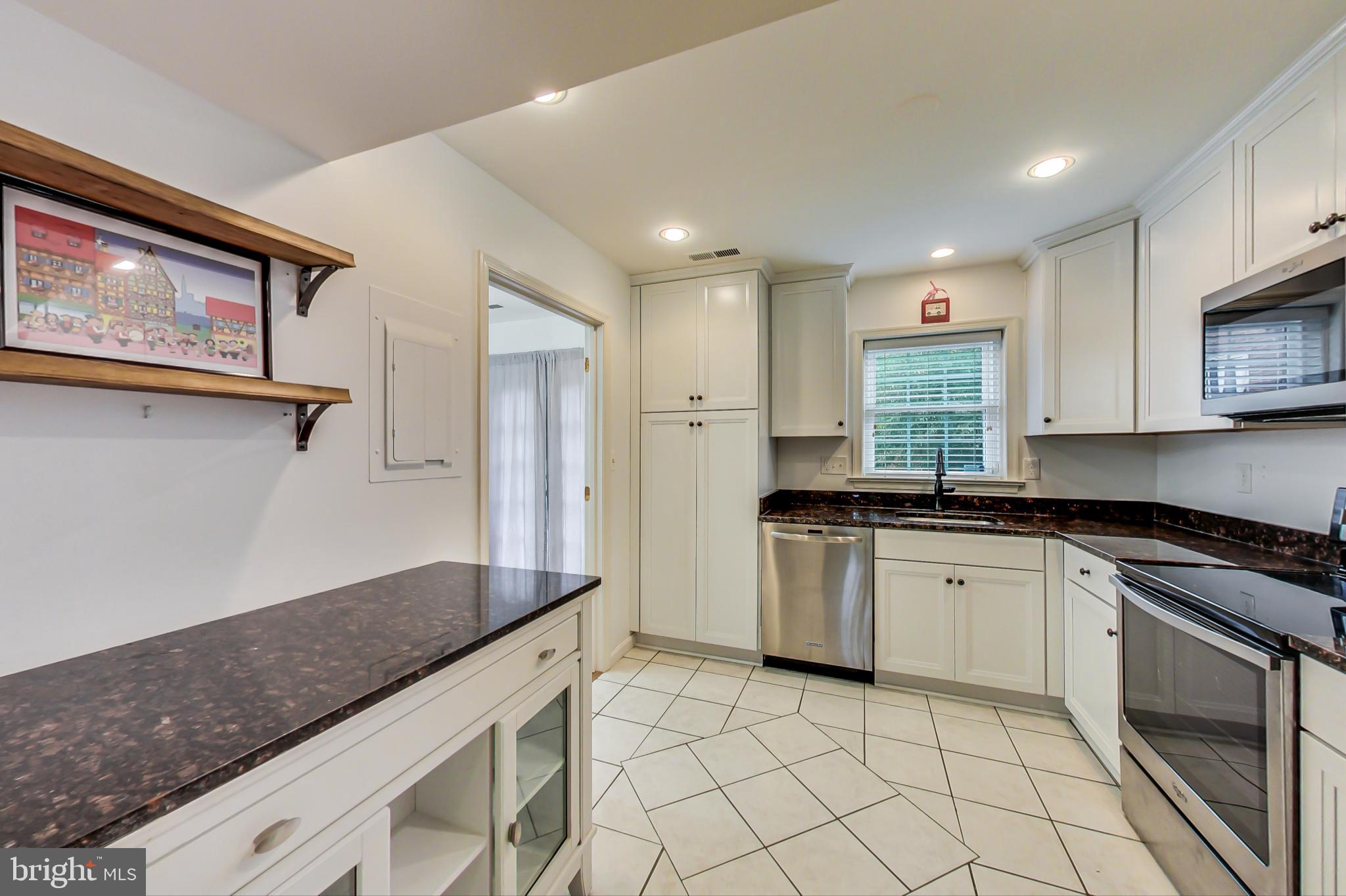 6718 Hillandale Road, Unit 16 Chevy Chase, MD 20815 - Photo 10 of 32 Ample White Cabinetry & Granite Countertops