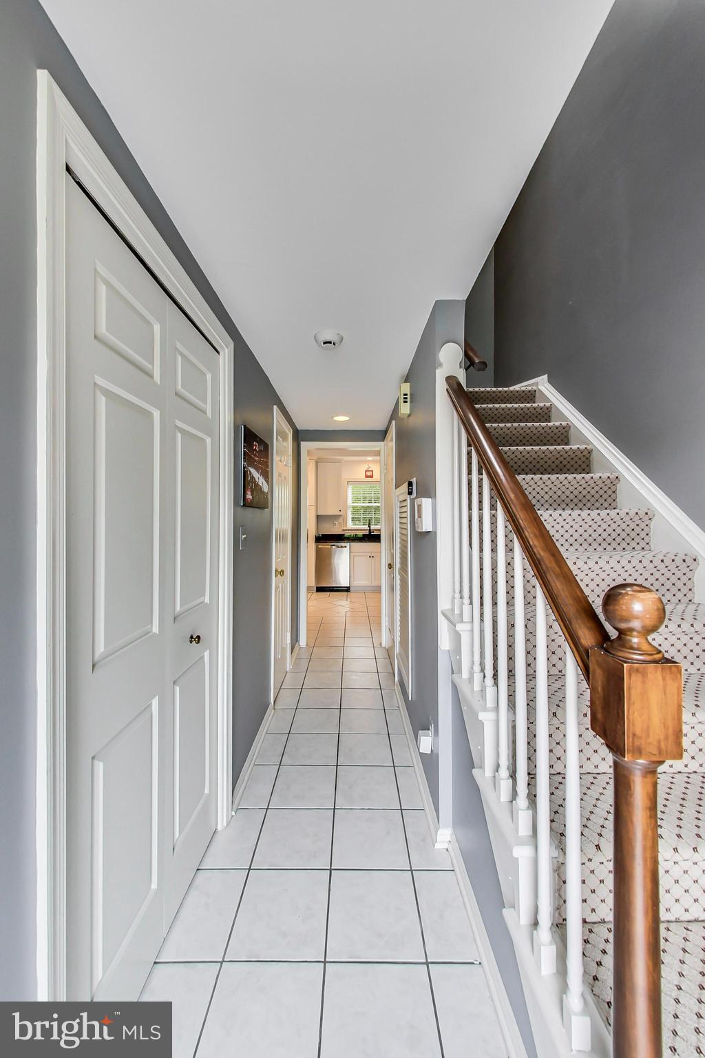 6718 Hillandale Road, Unit 16 Chevy Chase, MD 20815 - Photo 2 of 32 Entryway with Coat Closet & Powder Room