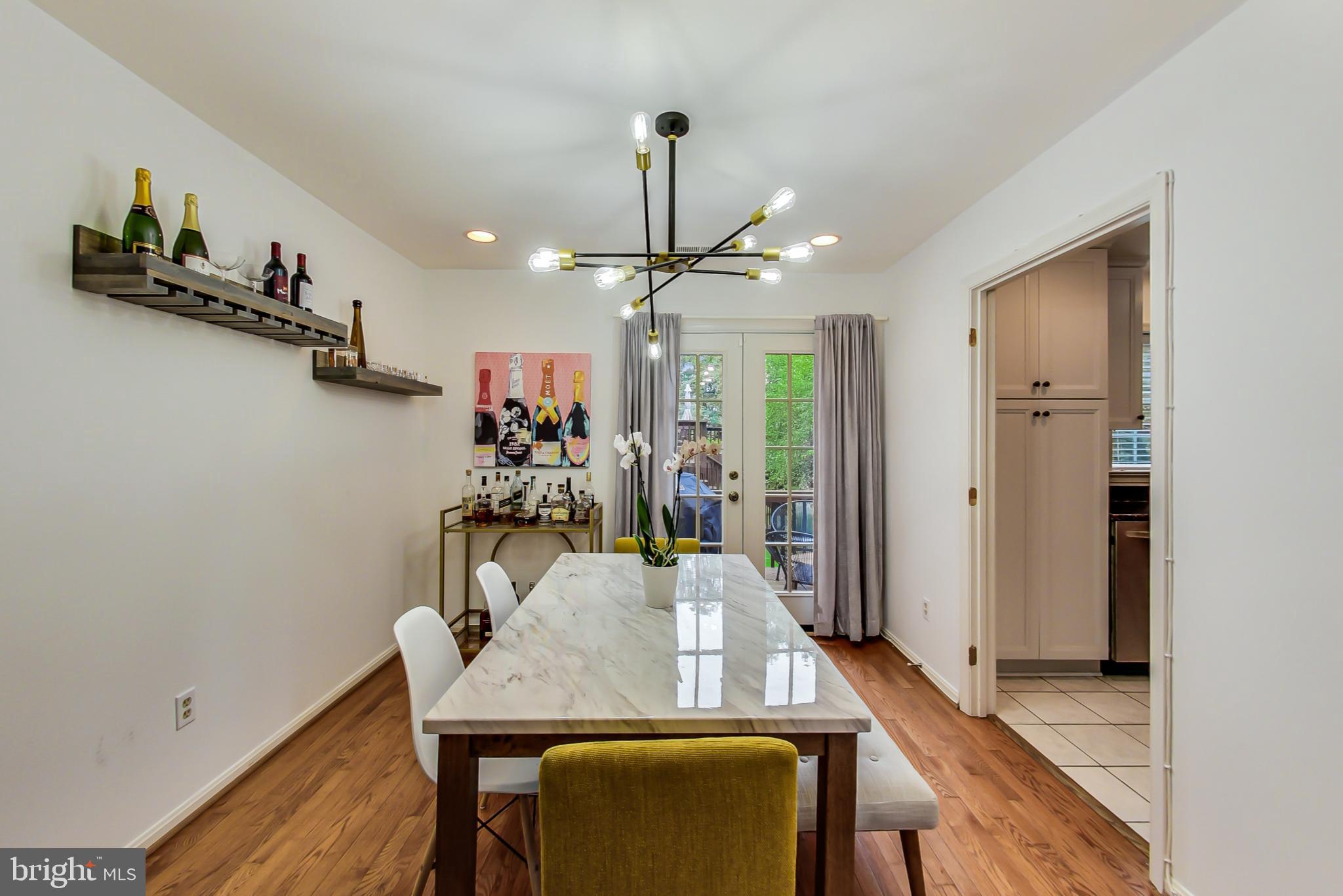 6718 Hillandale Road, Unit 16 Chevy Chase, MD 20815 - Photo 6 of 32 Bright Dining Room w/ French Doors to Back Deck