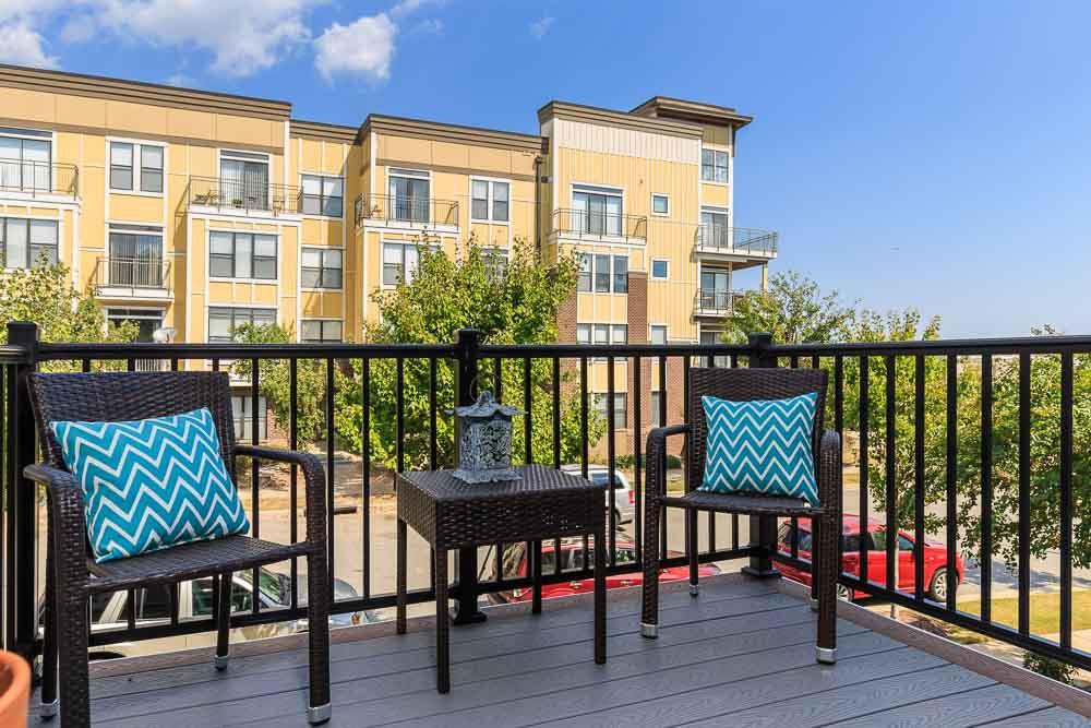 9154 Wooden Road Raleigh, NC 27617 - Photo 4 of 25 Enjoy mornings, afternoons and evenings on the front balcony.