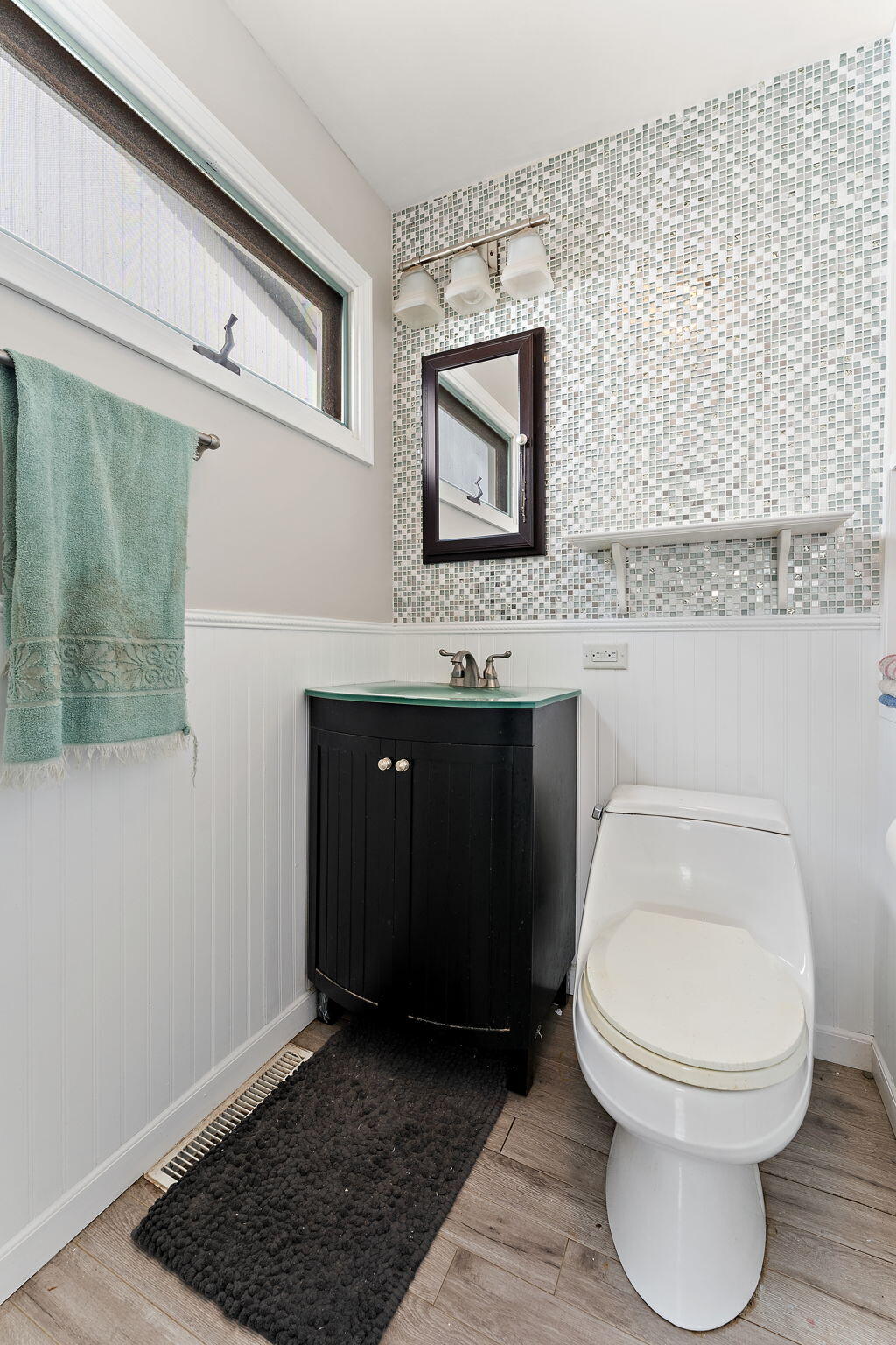 5590 East Maple Street Knox, IN 46534 - Photo 17 of 32 a bathroom with a toilet a sink and mirror